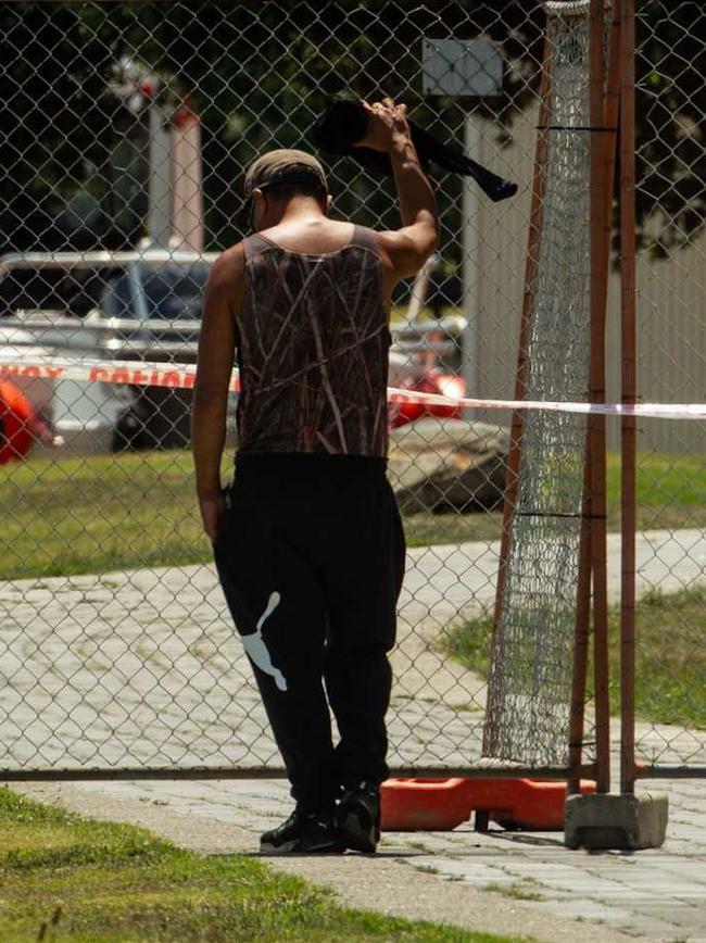 A man at the gate to Whakatane Wharf as preparations are made to attempt a rescue of the remaining people on White Island. Picture: NZ Herald