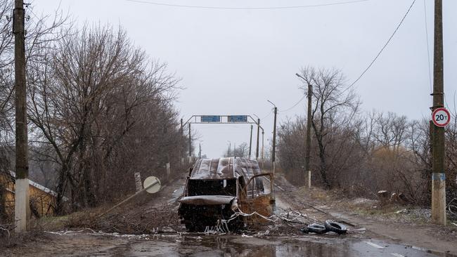 A burnt out vehicle sits in the road in Ukraine. Picture: Getty Images.