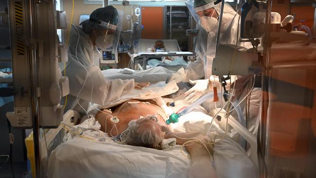 A COVID-19 patient is treated in intensive care at Casal Palocco Hospital, near Rome, this week. Picture: AFP)