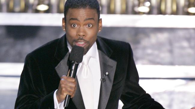 FILE - In this Feb. 27, 2005 file photo, Chris Rock hosts the 77th Academy Awards telecast in Los Angeles. Rock will return to host the Oscars for a second time. Rock, who will return to host the 88th Academy Awards on Feb.28, has made no decisions about his opening monologue. Rock’s publicist, in a statement Monday, refuted earlier comments by Academy Awards co-producer Reginald Hudlin that Rock had scraped earlier plans and was rewriting the show following the backlash to the entirely white acting nominees. (AP Photo/Mark J. Terrill, File)