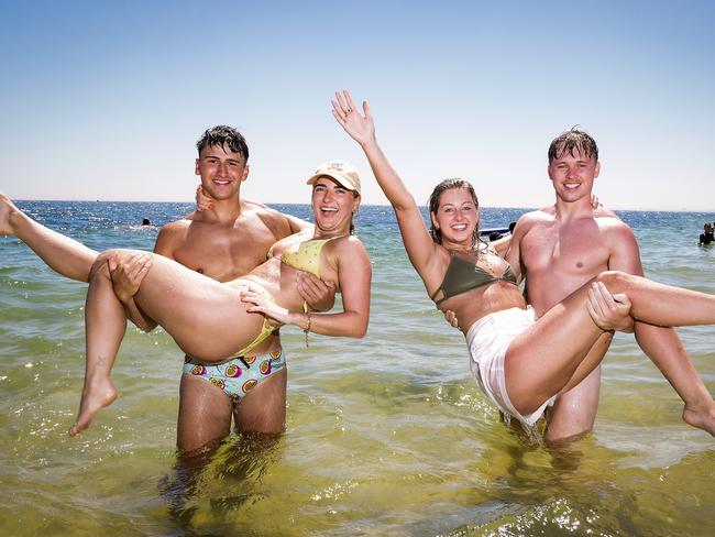 George Dignum, Ally Jones, Matthew Mills and Jazzy Williams enjoying Brighton Beach on Sunday. Picture: Ian Currie