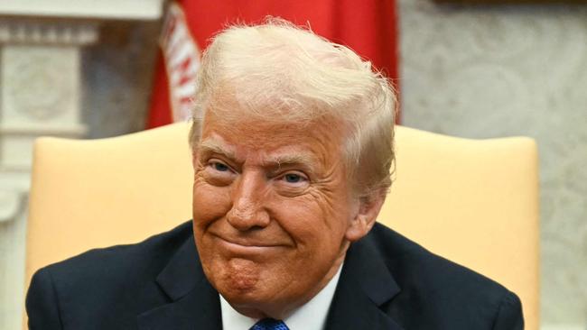 TOPSHOT - US President Donald Trump looks on during a meeting with Japanese Prime Minister Shigeru Ishiba in the Oval Office of the White House in Washington, DC, on February 7, 2025. (Photo by Jim WATSON / AFP)