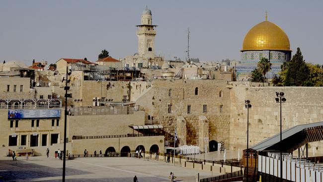 The Western Wall and the Dome of the Rock. A town square normally brimming with feasting, haggling and beckoning from store owners is almost bereft of souls.