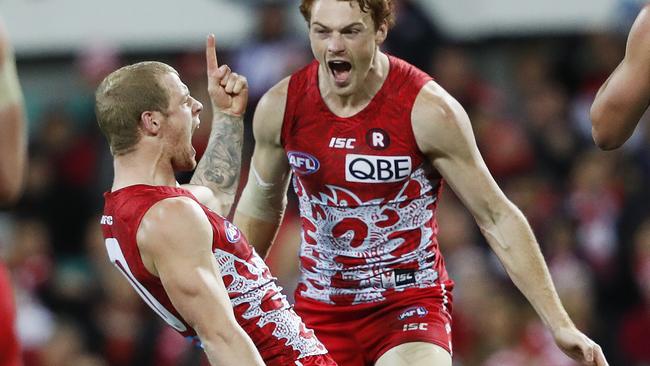 Zak Jones celebrates a goal with teammate Gary Rohan. Picture: Phil Hillyard