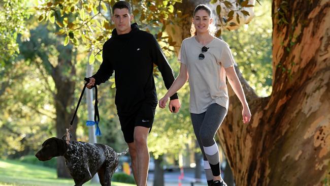 Siblings Alice and Sam Reynolds are a healthy looking fit couple walking around the Tan. Picture: Tony Gough