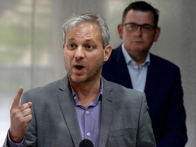 MELBOURNE, AUSTRALIA - NewsWire Photos FEBRUARY 15, 2021: Victoria's Chief Health Officer Brett Sutton addresses the media at the Treasury in Melbourne as Premier Daniel Andrews looks on. Picture: NCA NewsWire / Andrew Henshaw