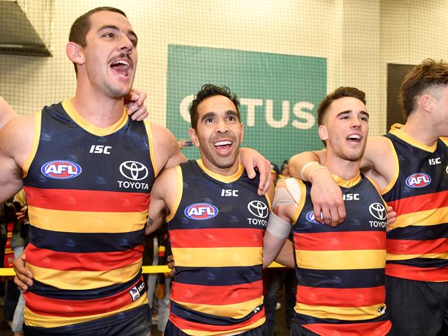 Taylor Walker, Eddie Betts, Lachlan Murphy, Jake Kelly  and Alex Keath of the Crows sing the club song after the Round 12 AFL match between the Adelaide Crows and the GWS Giants at Adelaide Oval in Adelaide, Saturday, June 8, 2019. (AAP Image/Sam Wundke) NO ARCHIVING, EDITORIAL USE ONLY