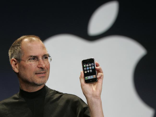 Apple CEO Steve Jobs holds up the new iPhone in 2007. Picture: AP