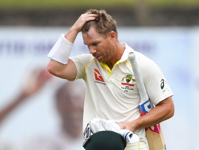 Australia's David Warner walks back to the pavilion after his dismissal during the fourth day of the second cricket Test match between Sri Lanka and Australia at the Galle International Cricket Stadium in Galle on July 11, 2022. (Photo by ISHARA S. KODIKARA / AFP)