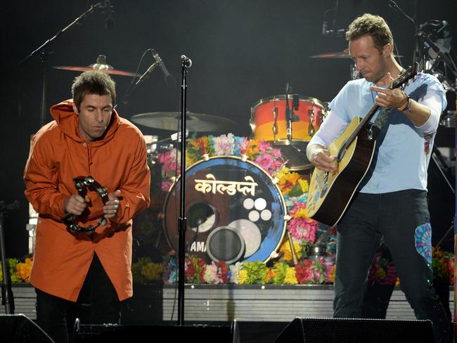 Liam Gallagher and Coldplay’s Chris Martin perform on stage on June 4, 2017 in Manchester, England. Picture: Getty Images/Dave Hogan for One Love Manchester