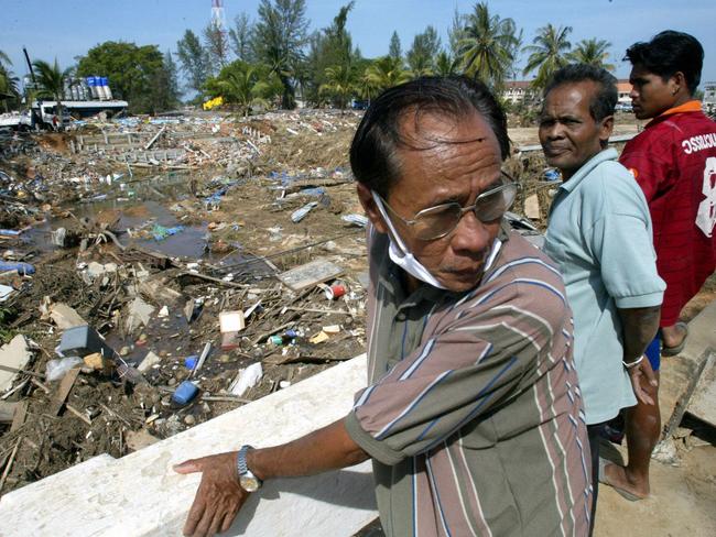 Desperate survivors search for family members in the devastation of Khao Lak, December 29, 2004. Picture: James Croucher