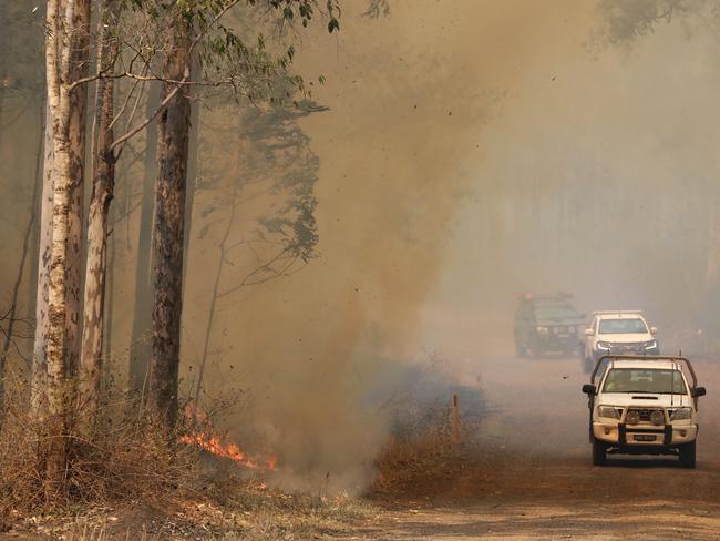 Firefighters battle bushfires in Busbys Flat, northern NSW, Wednesday, October 9, 2019. (AAP Image/Jason O'Brien)