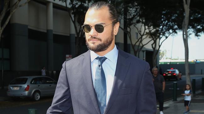 Rugby union player Karmichael Hunt leaves the Magistrates Court in Brisbane on Monday, February 19, 2018. Mr Hunt has had a drugs charge dropped due to a lack of evidence but has been fined $600. (AAP Image/Jono Searle) NO ARCHIVING