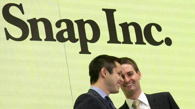 Snapchat co-founders Bobby Murphy, left, and CEO Evan Spiegel ring the opening bell at the New York Stock Exchange as the company celebrates its IPO. Source: Associated Press.