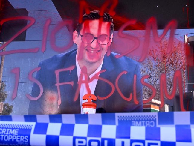 The slogan "Zionism is Fascism" is sprayed on the electoral office of Australian federal Labor Party member of parliament Josh Burns in the Melbourne suburb of St Kilda after police said at least five people smashed windows and painted slogans on the walls on June 19, 2024. It is the latest in a string of acts of vandalism targeting the offices of state and federal MPs in the wake of the conflict in Gaza. (Photo by William WEST / AFP)