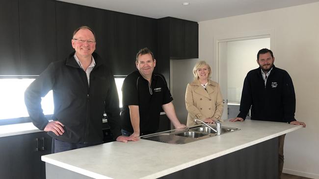 Housing Minister Roger Jaesnch, Liberal candidates Adam Brooks, Stacey Sheehan and Felix Ellis in a new housing development at Stony Rise on Tuesday, April 20, 2021.