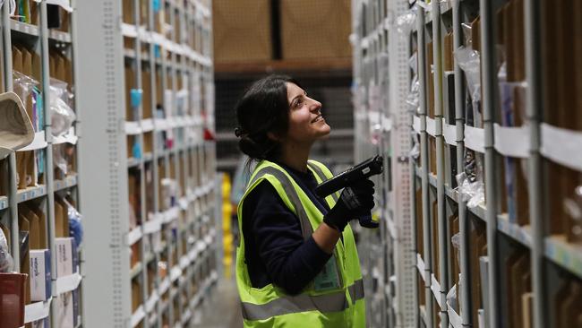 Ru'a Abed scanning items at the Amazon fulfilment centre in Moorebank. Picture: Carmela Roche