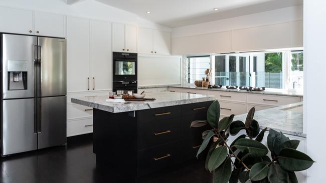 AFTER: Marble counter tops and integrated gas burners feature in the new kitchen. Picture: Nadja Farghaly