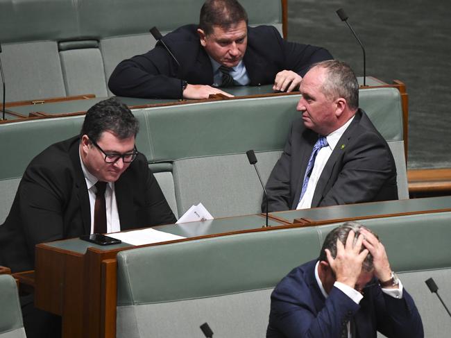 Former Nationals MP Llew O'Brien (top) speaks to Nationals MPs Barnaby Joyce, George Christensen and David Gillespie during House of Representatives Question Time at Parliament House in Canberra, Monday, February 10, 2020. (AAP Image/Lukas Coch) NO ARCHIVING