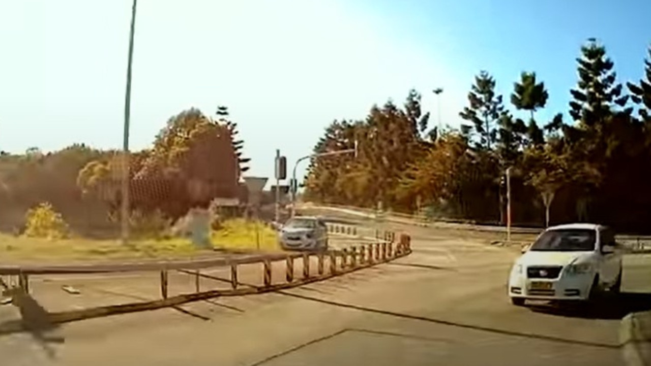 After making impact the second time, the silver car (left) then drives onto the grassy verge. Picture: YouTube/Dash Cam Owners Australia