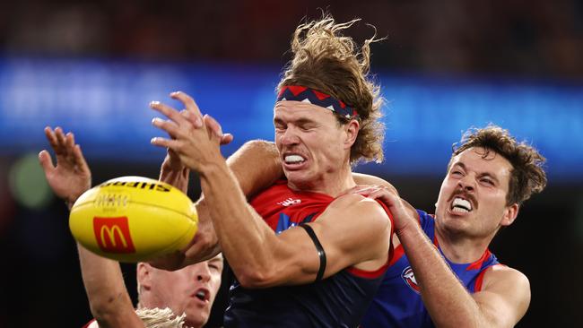 Jayden Hunt of the Demons tries to mark in front of Bulldog Zanie Cordy. Picture: Michael Klein