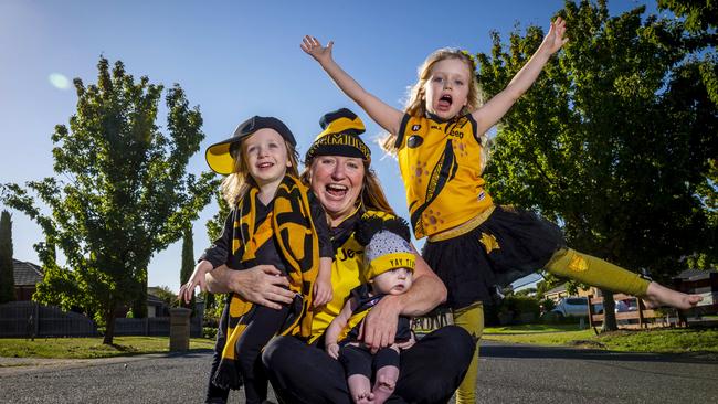 Richmond supporters are getting excited for the opening game of the AFL season on Thursday night. Jo Michielin and her kids Arthur, 5 months, Charlie, 2 and Lily, 5. Picture: Jake Nowakowski