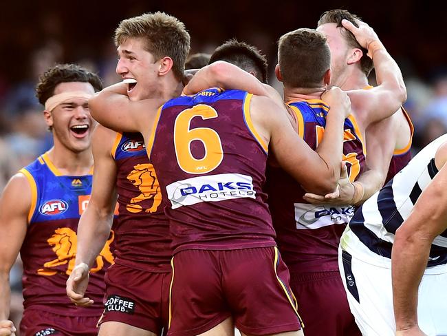 BRISBANE, AUSTRALIA - AUGUST 17: The Lions players celebrate victory after the round 22 AFL match between the Brisbane Lions and the Geelong Cats at The Gabba on August 17, 2019 in Brisbane, Australia. (Photo by Bradley Kanaris/AFL Photos via Getty Images )