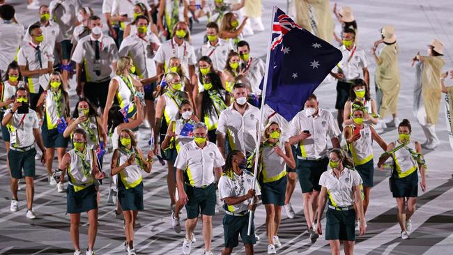 TOKYO, JAPAN - JULY 23: Flag bearers Cate Campbell and Patty Mills of Team Australia lead their team during the Opening Ceremony of the Tokyo 2020 Olympic Games at Olympic Stadium on July 23, 2021 in Tokyo, Japan. (Photo by Patrick Smith/Getty Images)