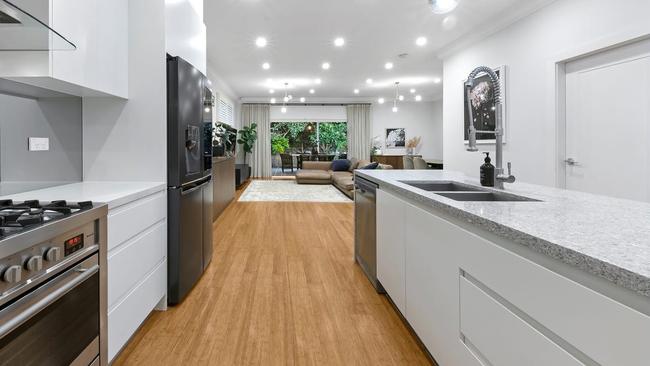 The galley-style kitchen in the Marshalls’ Canada Bay home …