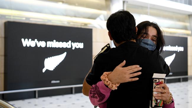 People are seen embracing as travellers arrive from Auckland on Air New Zealand flight NZ101 at Sydney International Airport. Picture: NCA NewsWire/Bianca De Marchi