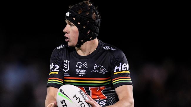 Matt Burton wearing his mates headgear during his debut with the Panthers last season.