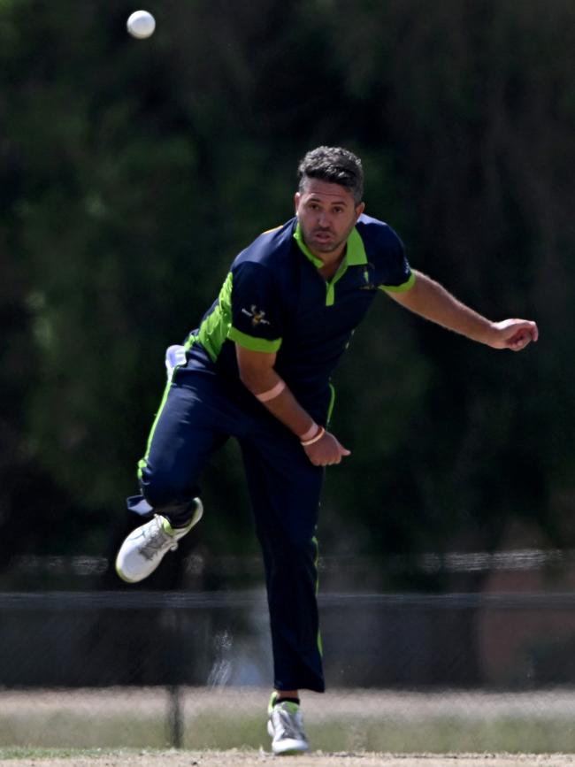 VTCA captain Mitch Johnstone (Yarraville Club) rolls the arm over. Picture: Andy Brownbill