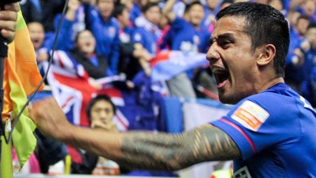 Tim Cahill celebrates after scoring for Shanghai Shenhua.