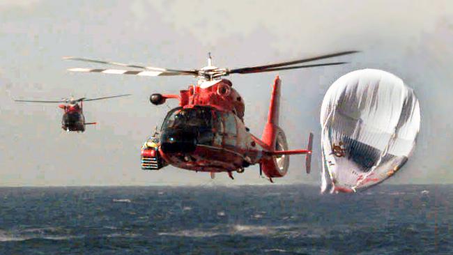 USA Coast Guard helicopters rescuing balloonists millionare Richard Branson, Steve Fossett and Per Lindstrand after their balloon ditched into the Pacific Ocean during non-stop around-world flight attempt 25 Dec 1998.