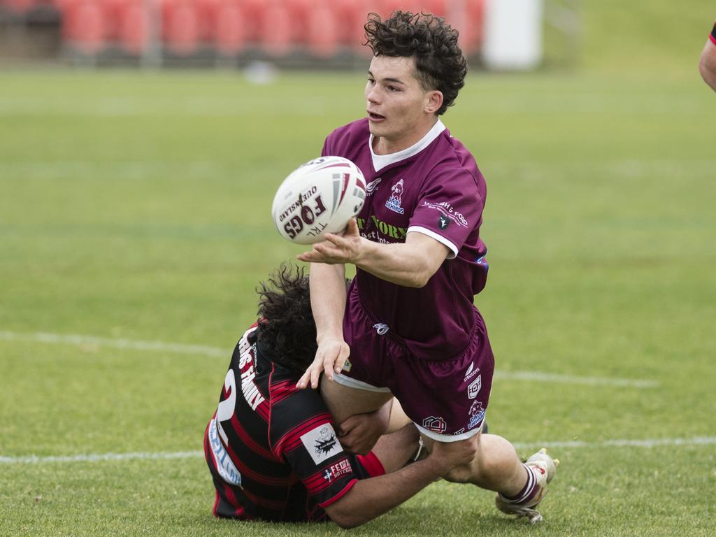 Bailey Rathmell making an offload while being taken to the ground. Picture: Kevin Farmer.