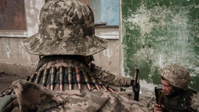 Ukrainian soldiers arrive at an abandoned building to rest and receive medical treatment after fighting on the front line for two months near Kramatorsk, eastern Ukraine. Picture: AFP