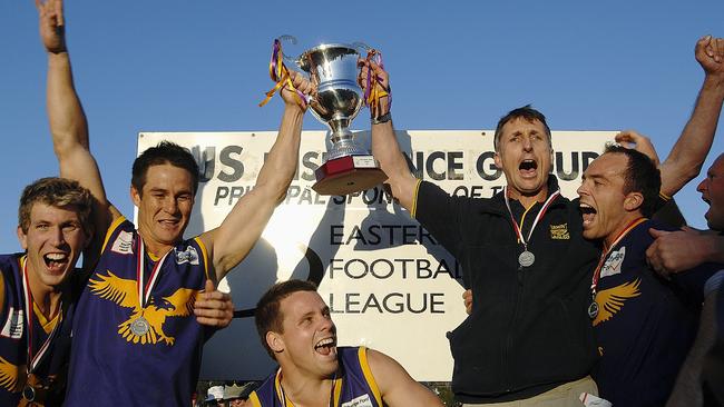 Robbie Ross (left) celebrates the 2007 premiership with David Banfield (second-right). Banfield coached the Eagles to four flags from 2004 to 2011. Picture: Joanna Fincham