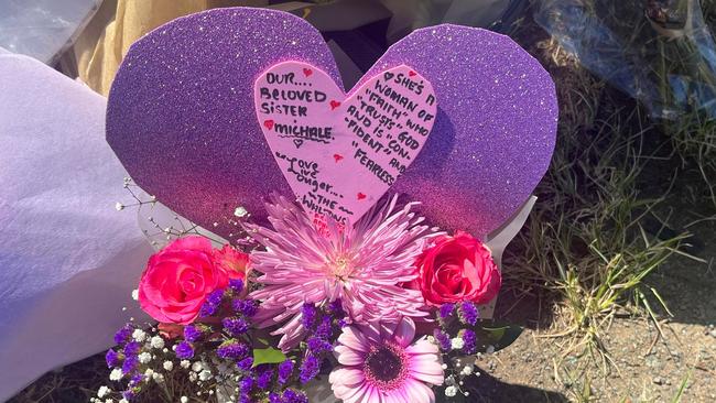 A heartfelt card dedicated to Michale Chandler sits at the crash site.