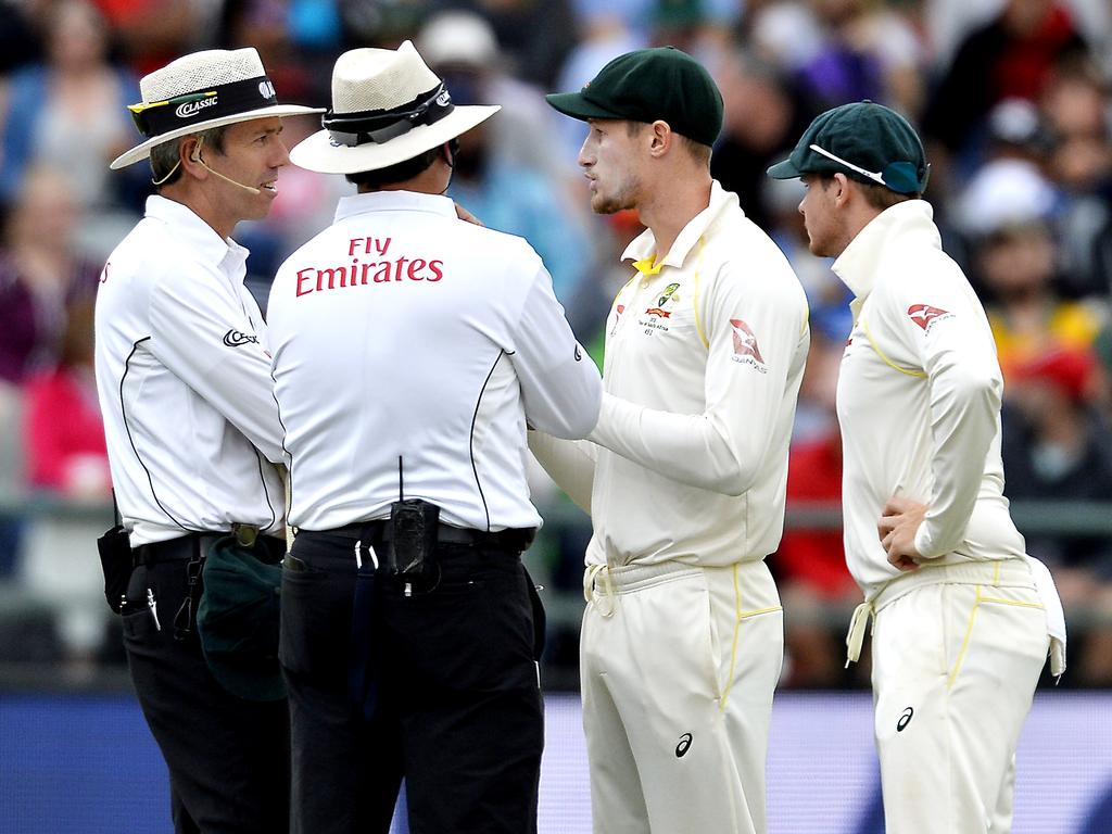 Umpires chatting with Cameron Bancroft and Steve Smith as the Sandpaper-Gate scandal exploded. Picture: Ashley Vlotman/Gallo Images/Getty Images