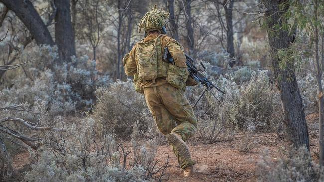 A soldier from the 5th Battalion, Royal Australian Regiment, rushes forward in a live fire attack exercise. Picture: Supplied