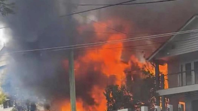 A multi-structure fire on Evelyn Street, Grange in Brisbane’s inner north on Saturday afternoon destroyed two homes and seriously injuring a man. Picture: QAS .