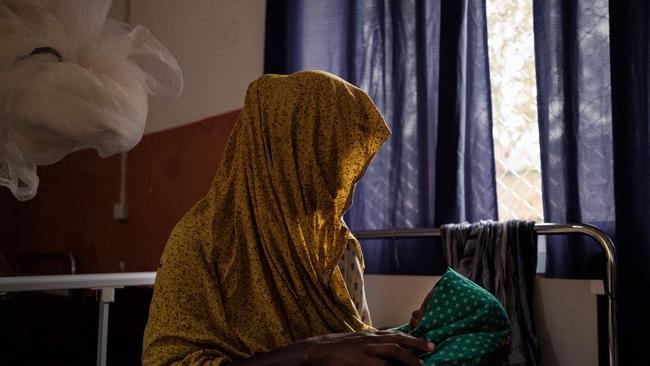 A mother cradles her child suffering from severe malnutrition in Baidoa, Somalia, where extreme drought has destroyed crops and led to the death of livestock. Picture: AFP