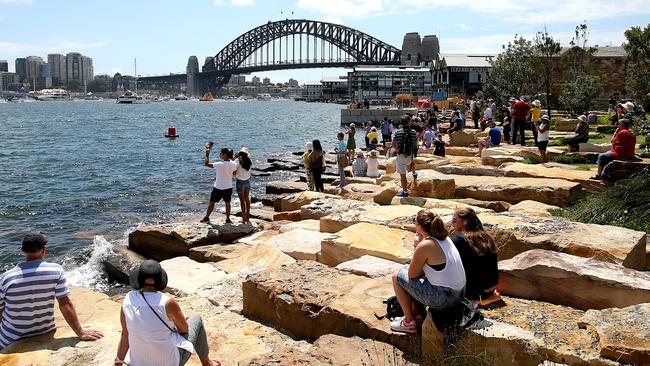 People enjoying the view at the Barangaroo foreshore. Picture: Tim Hunter