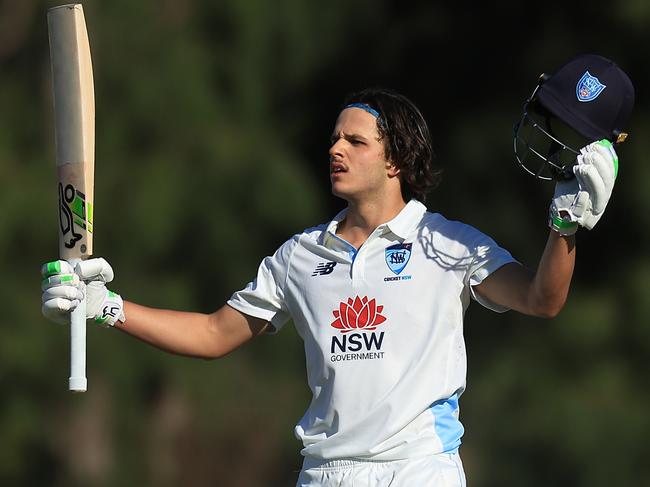 SYDNEY, AUSTRALIA - OCTOBER 10: Sam Konstas of the Blues raises his bat in the air after hitting a six to reach his century during the Sheffield Shield match between New South Wales and South Australia at Cricket Central, on October 10, 2024, in Sydney, Australia. (Photo by Mark Evans/Getty Images)