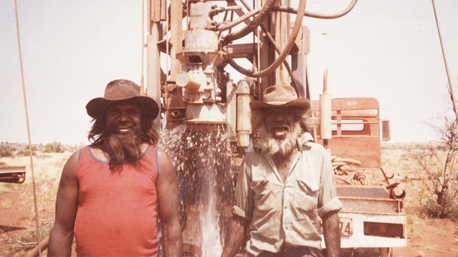 Muuki (L) striking water new bore Punmu 1982. Picture: John Smart