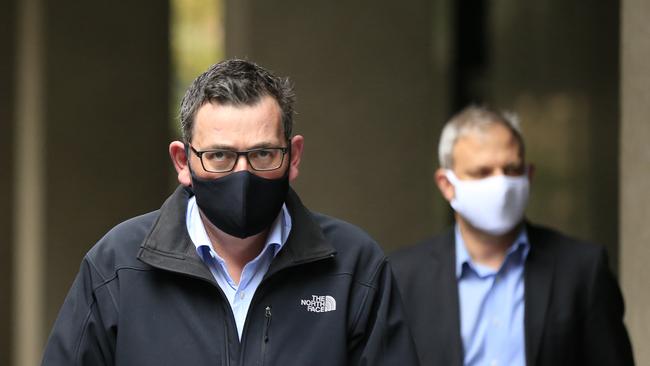 Premier Daniel Andrews and Chief Health Officer Brett Sutton arrive for another daily briefing. Picture: Getty