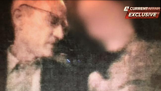 One Nation party official Steve Dickson filmed in a strip club in America, fondling and giving money to one of the strippers. Picture: Channel 9