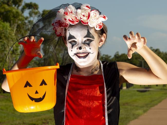 Palmerston girl Akira Lay is prepping for a night of trick-or-treating with her friends and family on Monday. Picture: Floss Adams.