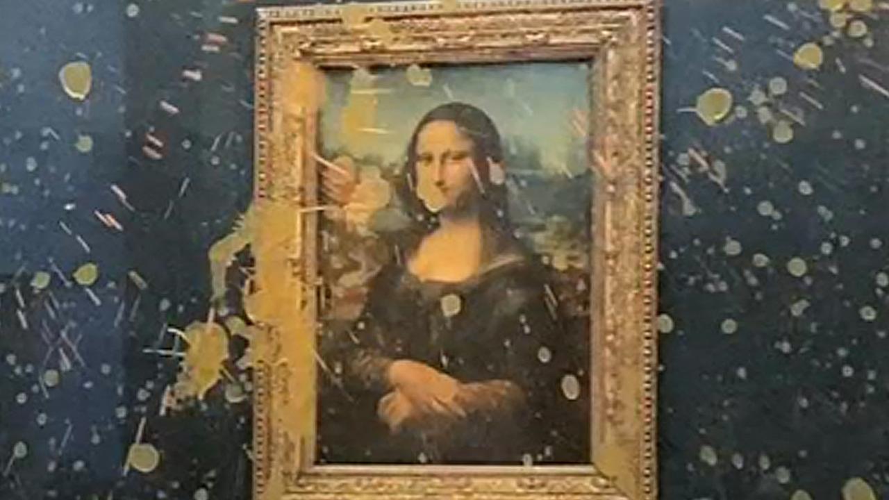 Luckily the painting is protected by glass. Picture: David Cantiniaux/AFPTV/AFP