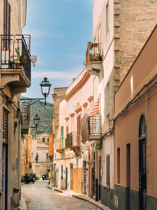 Lined with gelati-hued houses, the backstreets of Favignana make for scenic strolling. Picture: Jack Johns.